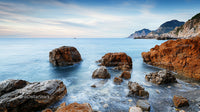Rocky Coastal Landscape with Tranquil Blue Sea