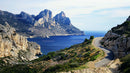 Winding Coastal Road with Majestic Cliffs and Blue Sea