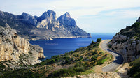 Winding Coastal Road with Majestic Cliffs and Blue Sea