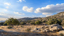 Scenic Desert Landscape with Rocky Hills and Blue Sky