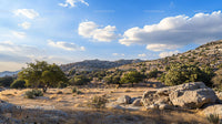 Scenic Desert Landscape with Rocky Hills and Blue Sky