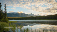 Serene Mountain Lake with Morning Mist and Reflections