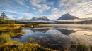 Misty Mountain Reflections at Sunrise Over a Serene Lake