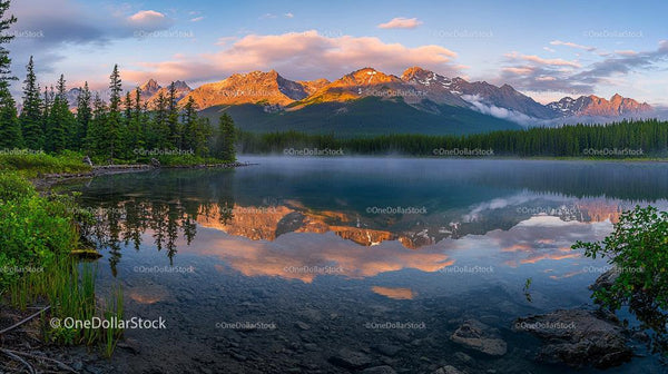Sunrise Over Tranquil Mountain Lake with Forest Reflection