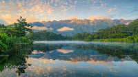 Misty Morning Reflections in Tranquil Mountain Lake