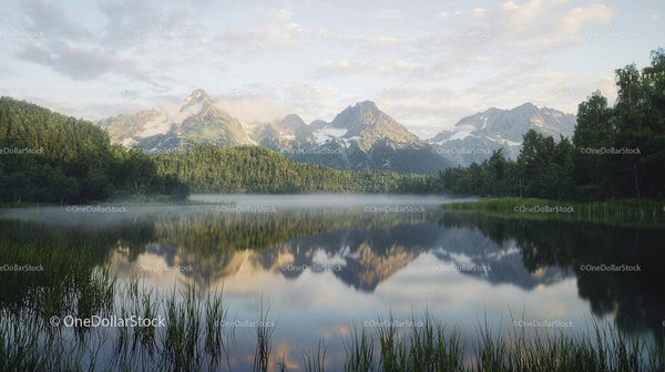 Tranquil Mountain Lake with Snow-Capped Peaks and Reflections