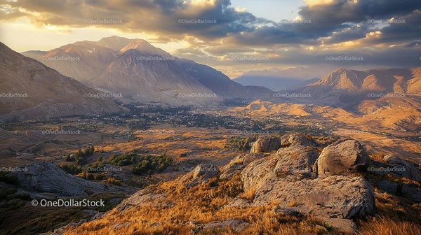 Majestic Mountain Valley at Golden Hour with Dramatic Clouds