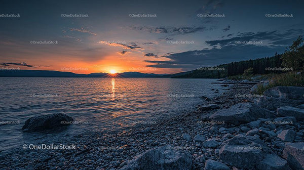 Scenic Sunset Over a Tranquil Lake with Rocky Shoreline