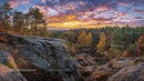 Sunset Over Rocky Forest with Autumn Colors and Dramatic Sky