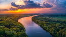 Stunning Aerial View of a River at Sunset with Lush Green Forests