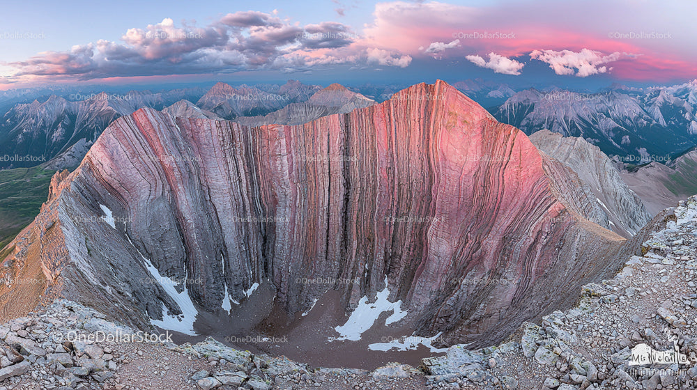 Scenic Mountain Panorama with Pink-Hued Peaks at Sunset