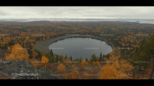 Autumnal Lake View Surrounded by Vibrant Woodland
