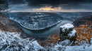 Dramatic Winter Landscape with Snow and Sunset Over River