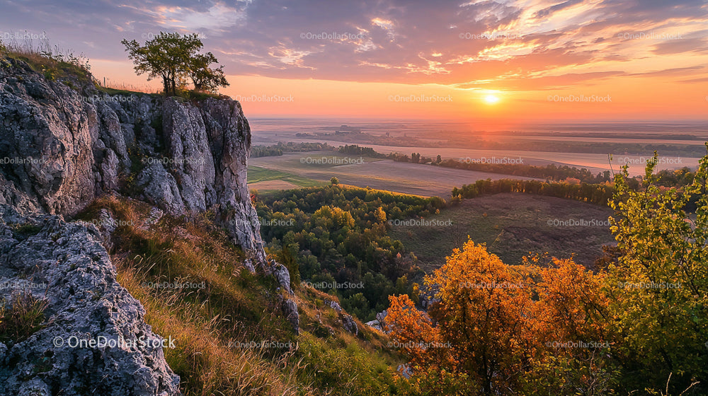 Rocky Cliff at Sunset with Vibrant Autumn Foliage