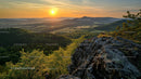 Sunset Over Scenic Mountain Landscape with Lush Greenery