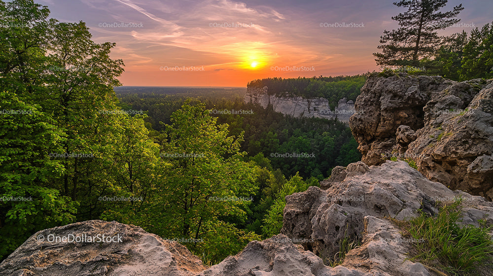 Sunset Over Rocky Cliffs with Lush Greenery