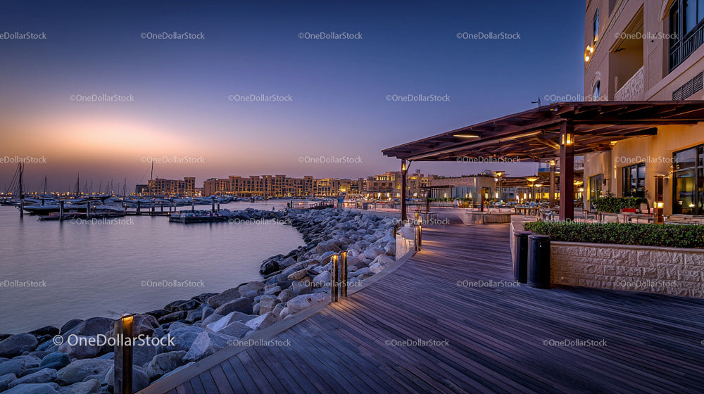 Sunset Marina Boardwalk with Luxury Yachts and Lights