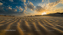 Majestic Sand Dunes at Sunset with a Dramatic Sky