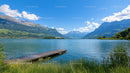Serene Mountain Lake with Wooden Dock and Clear Sky
