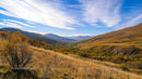 Scenic Mountain Landscape with Autumn Foliage and Blue Skies