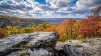Scenic Autumn Landscape with Vibrant Foliage and Rocky Foreground