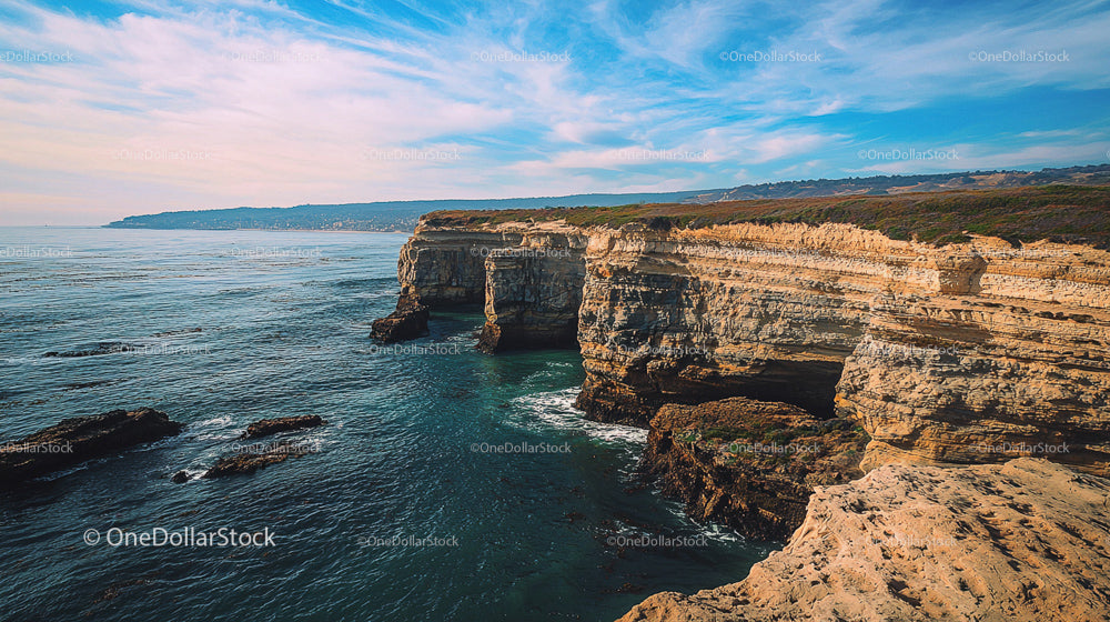 Rugged Coastal Cliffs Under a Vast Blue Sky
