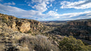 Scenic Canyon Landscape with Rugged Cliffs and Blue Sky