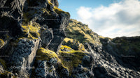 Moss-Covered Rocky Cliff in a Scenic Natural Landscape