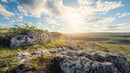 Sunlit Rocky Landscape Under a Dramatic Sky