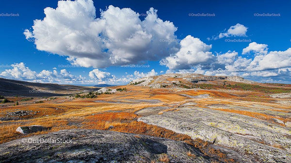 Vast Rocky Landscape Under Majestic Cloudy Sky