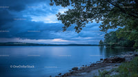 Serene Evening at a Lakeside with Dramatic Cloudscape