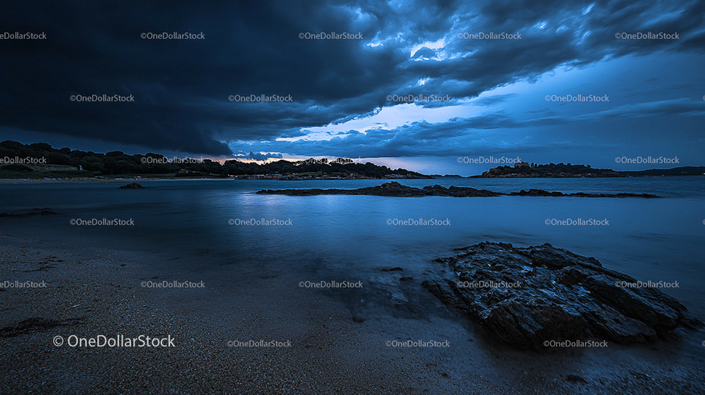 Dramatic Storm Clouds Over a Serene Coastal Landscape