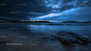 Dramatic Storm Clouds Over a Serene Coastal Landscape