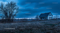 Abandoned House in a Mysterious Rural Landscape at Dusk