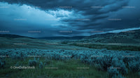 Moody Landscape with Stormy Sky Over Rolling Green Hills