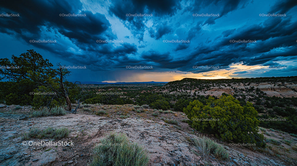 Dramatic Sunset Over Rugged Desert Landscape