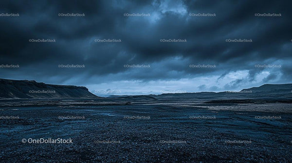 Dramatic Stormy Sky Over Rocky Terrain at Dusk