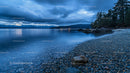 Pebble Beach at Twilight with Mountain and Lake View