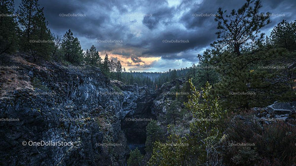 Dramatic Canyon Landscape at Sunset with Stormy Skies