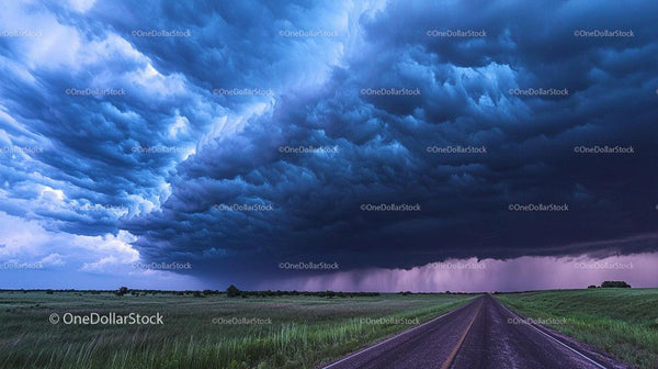 Dramatic Storm Clouds Over Open Prairie Road