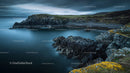 Dramatic Coastal Landscape with Rocky Shoreline and Serene Waters