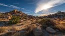 Sunlit Rocky Desert Landscape with Clear Blue Sky