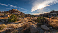 Sunlit Rocky Desert Landscape with Clear Blue Sky