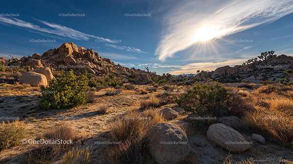 Sunlit Rocky Desert Landscape with Clear Blue Sky