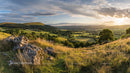 Sunset Over Lush Green Hills and Valleys
