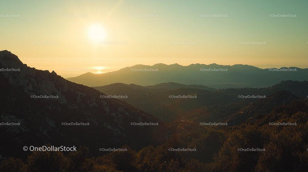 Serene Sunset Over Majestic Mountain Range