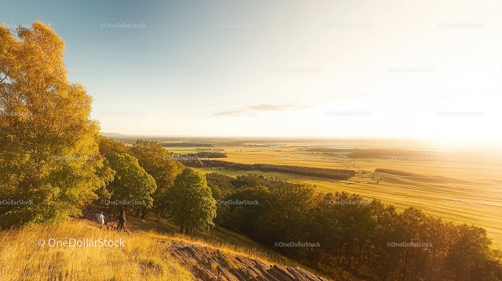 Sunset Over Autumn Landscape with Expansive Fields
