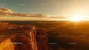 Majestic Sunset Over Sandstone Cliffs in Remote Wilderness