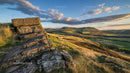 Stone Formation Overlooking Rolling Hills at Sunset