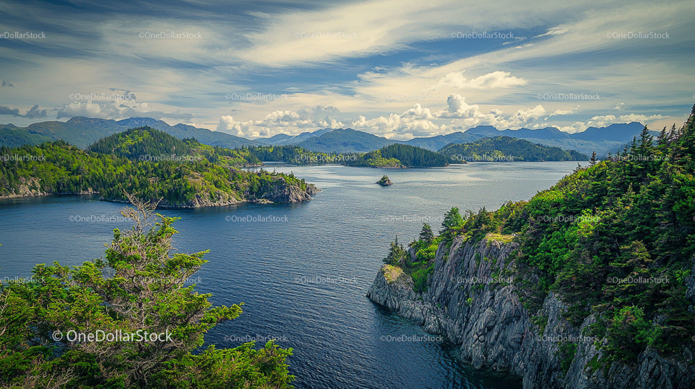 Peaceful Coastal View with Lush Islands and Mountains